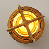 Top view of the lamp looking down into the lit acrylic tube and handle
