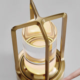 Angled studio view of the gold lamp showing the squared carry handle
