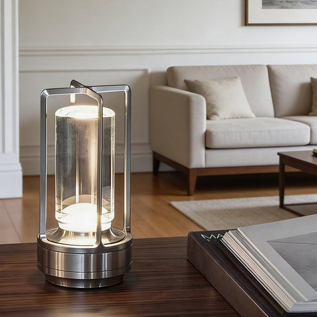 Silver lamp lit on a console table in a bright modern living room