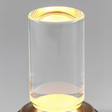 Close up of the clear acrylic tube lit warm from the base below