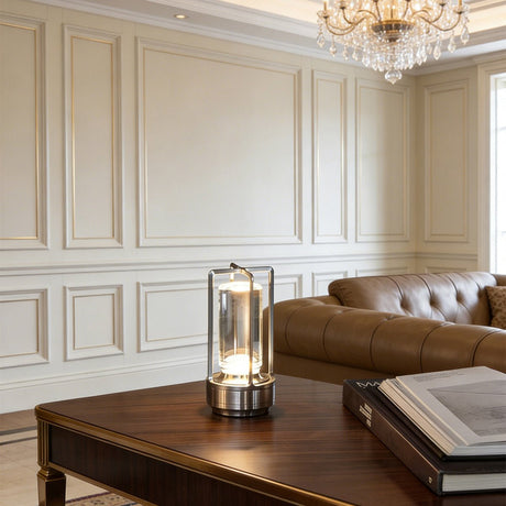 Silver cordless lamp on a dark wood table in a panelled sitting room