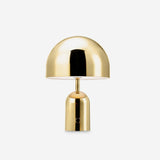 Studio product view of the gold gloss dome lamp on its rounded base