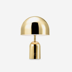 Studio product view of the gold gloss dome lamp on its rounded base