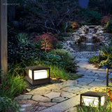 Aluminium post cap outdoor landscape light in a garden setting