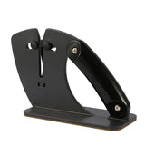 Black knife sharpener with non-slip base on countertop
