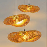 Handwoven bamboo shade against a pale wall in daylight