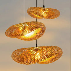 Handwoven bamboo shade against a pale wall in daylight