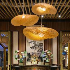 Bamboo shade lifting on one side to show the asymmetric weave