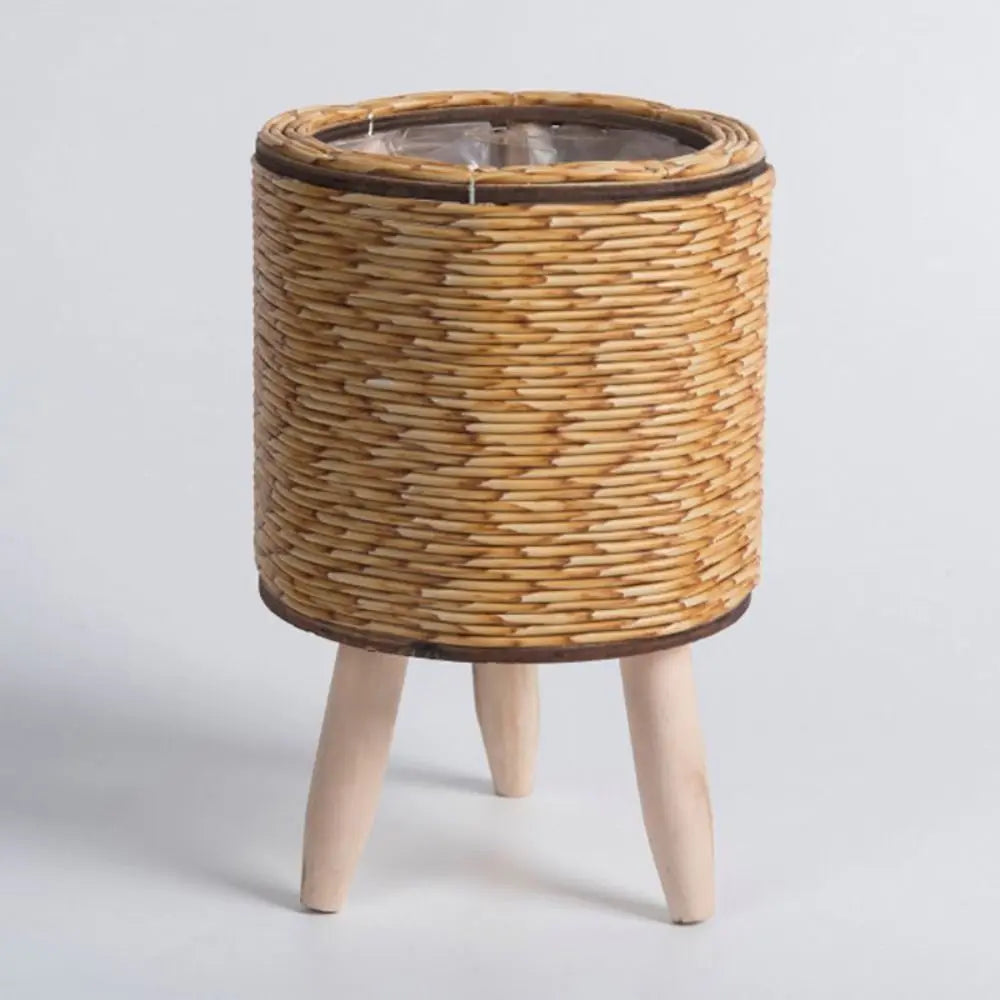 Rattan planter on legs styled in modern living room