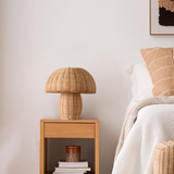 Rattan table lamp front view showing the domed woven shade