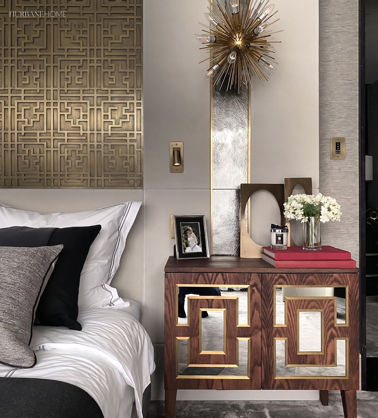 Reading wall sconce in a bedroom above a mirrored bedside console