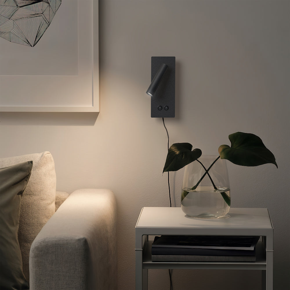 Modern LED wall sconce with backlight washing the wall