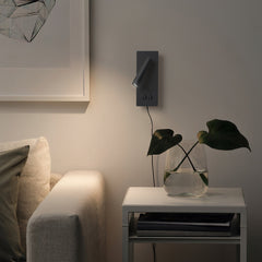 Modern LED wall sconce with backlight washing the wall