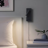 Close view of the reading wall light spotlight and warm glow