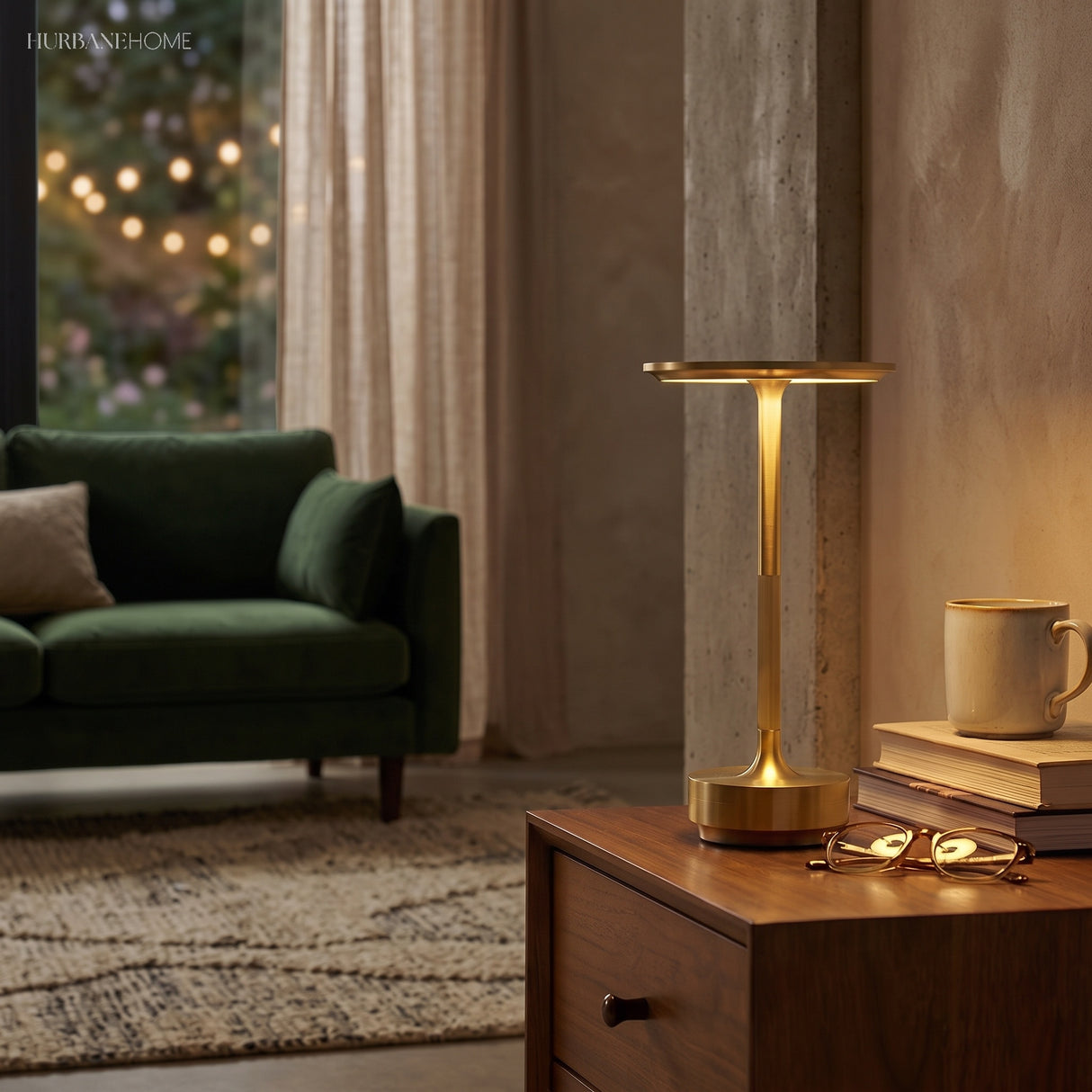 Cordless dish lamp glowing on a bedside table next to books