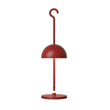 Red portable LED table lamp showing the dome shade, stem and flat round base