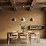 Three resin dome pendants above a dining table under timber beams