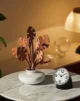 Retro desk clock on office desk with angled design