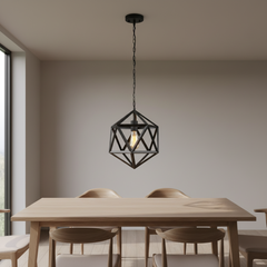 A black geometric wireframe pendant light hangs above a light wood dining table with four chairs in a minimalist dining room.