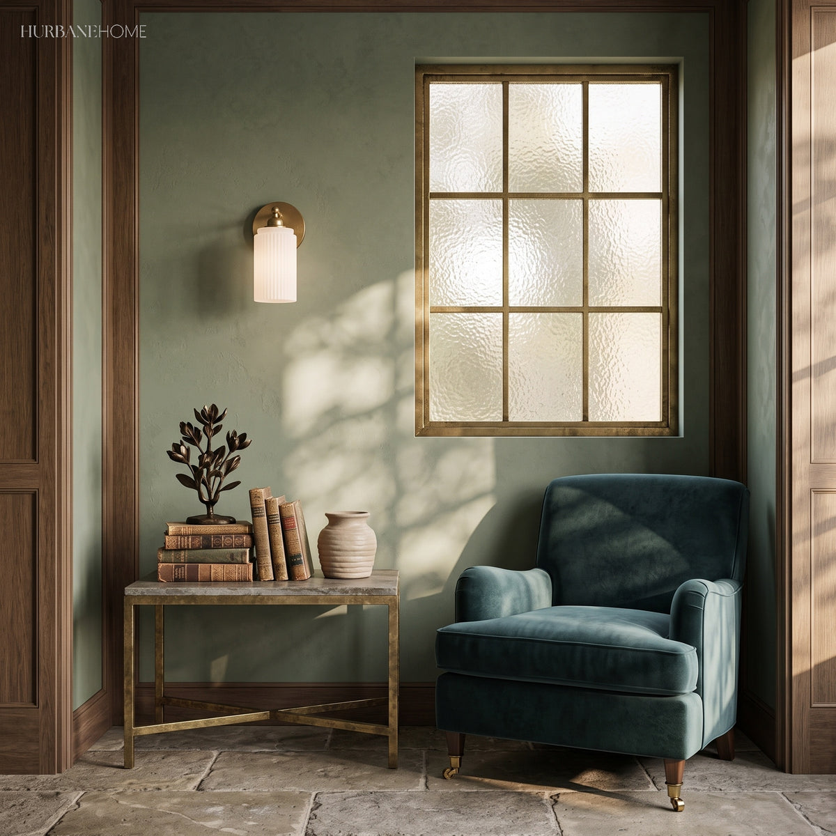 Ribbed glass brass sconce on a green wall beside a window and armchair