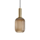 Amber ribbed capsule pendant with a brass collar on white