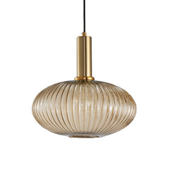 Amber ribbed oval pendant with a brass collar, shown on white