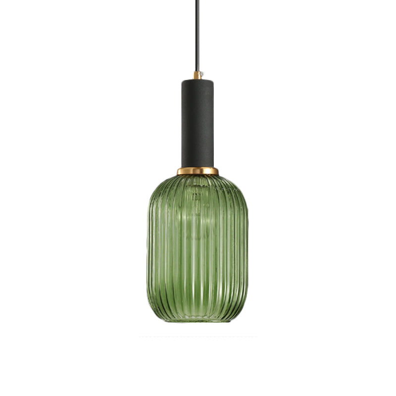 Green ribbed capsule pendant with a black collar on white
