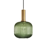 Green ribbed cylinder pendant with a brass collar on white