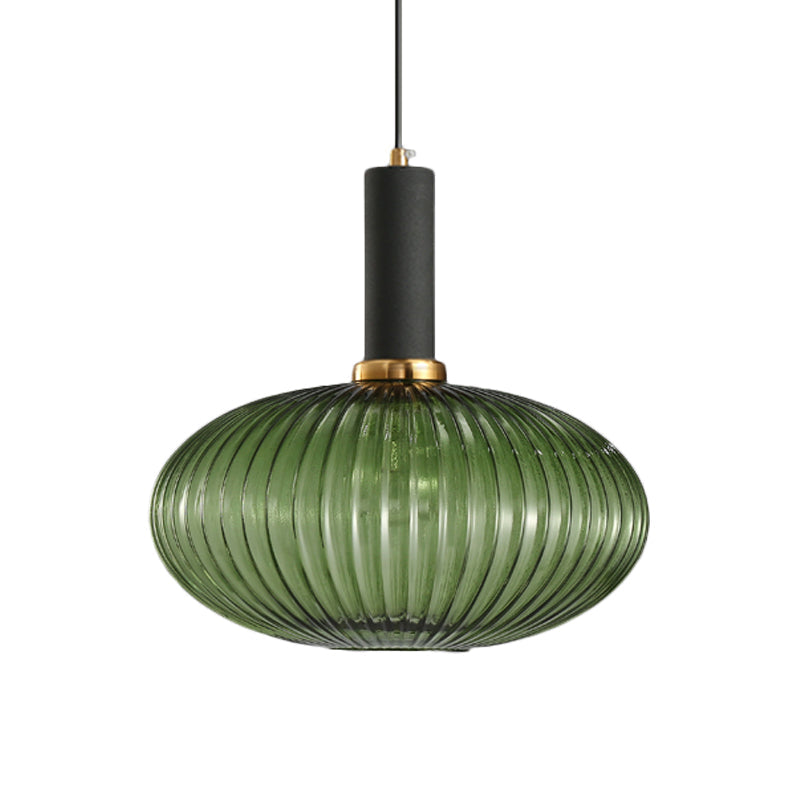 Green ribbed oval pendant with a black collar, shown on white