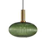 Green ribbed oval pendant with a brass collar, shown on white