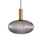 Smoke ribbed oval pendant with a brass collar, shown on white