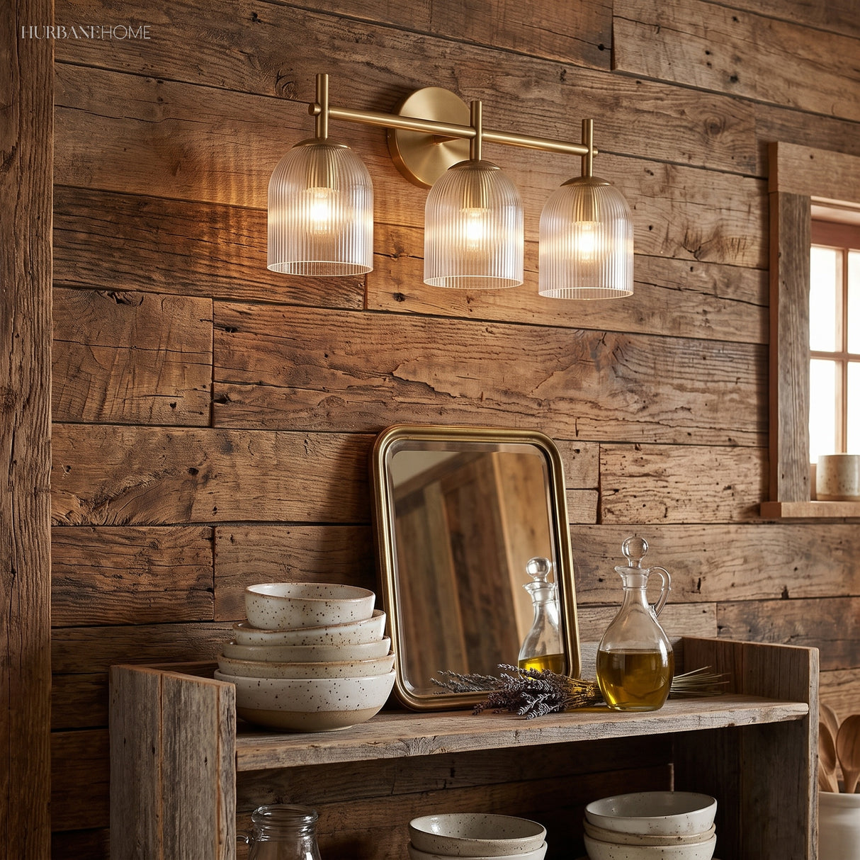 Brass ribbed glass sconce lit against a soft green panelled wall