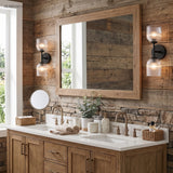 Ribbed glass vanity light above a mirror in an oak bathroom
