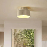 Ribbed resin ceiling light close up showing the vertical fluting on the shade