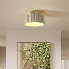Ribbed resin ceiling light close up showing the vertical fluting on the shade