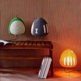 Rice paper table lamp on wire tripod legs, product view