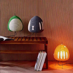 Rice paper table lamp on wire tripod legs, product view