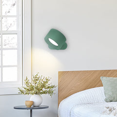 Rotatable reading light mounted on a wall