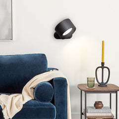 Rotatable wall sconce head tilted to show 360 degree rotation