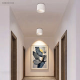 Round adjustable LED spotlight in a styled interior