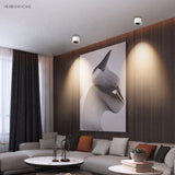 Round adjustable LED spotlight in a styled interior