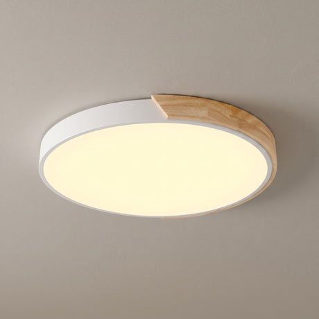 White round LED ceiling light with a wood accent segment on the rim
