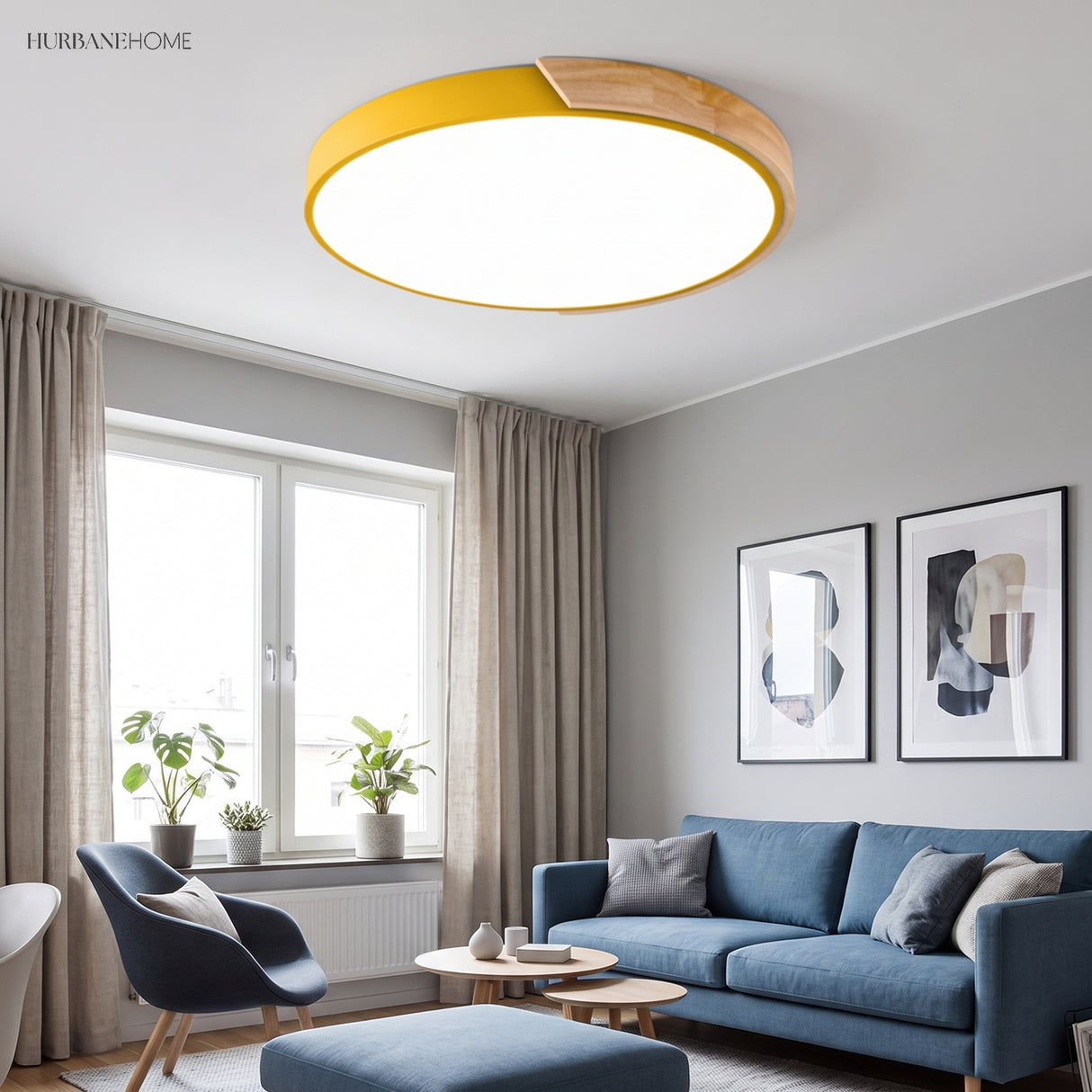 Yellow round LED ceiling light with a wood rim above a blue sofa and armchair