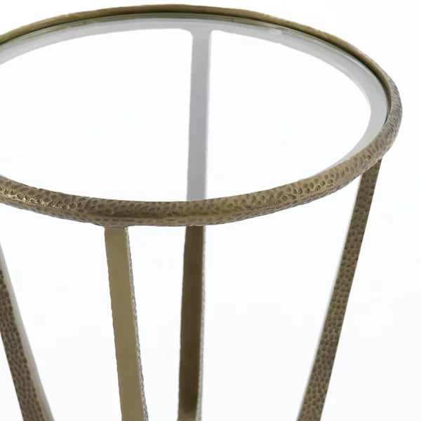 Round metal end table with glass top styled in mid century living room