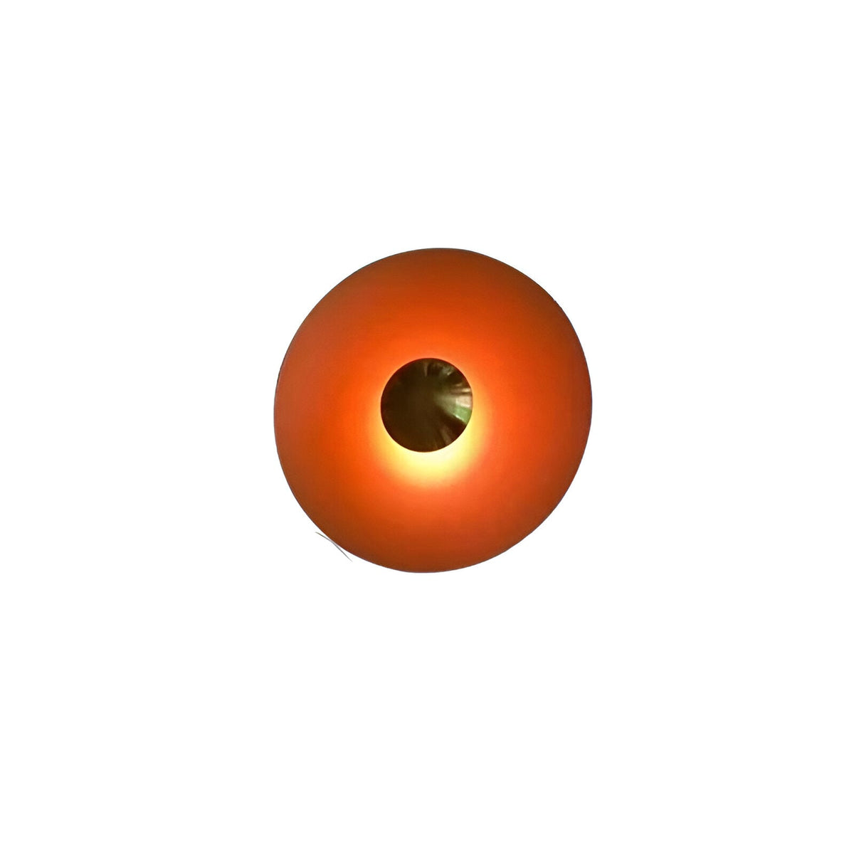 Orange red disc sconce with a chrome centre on a white ground
