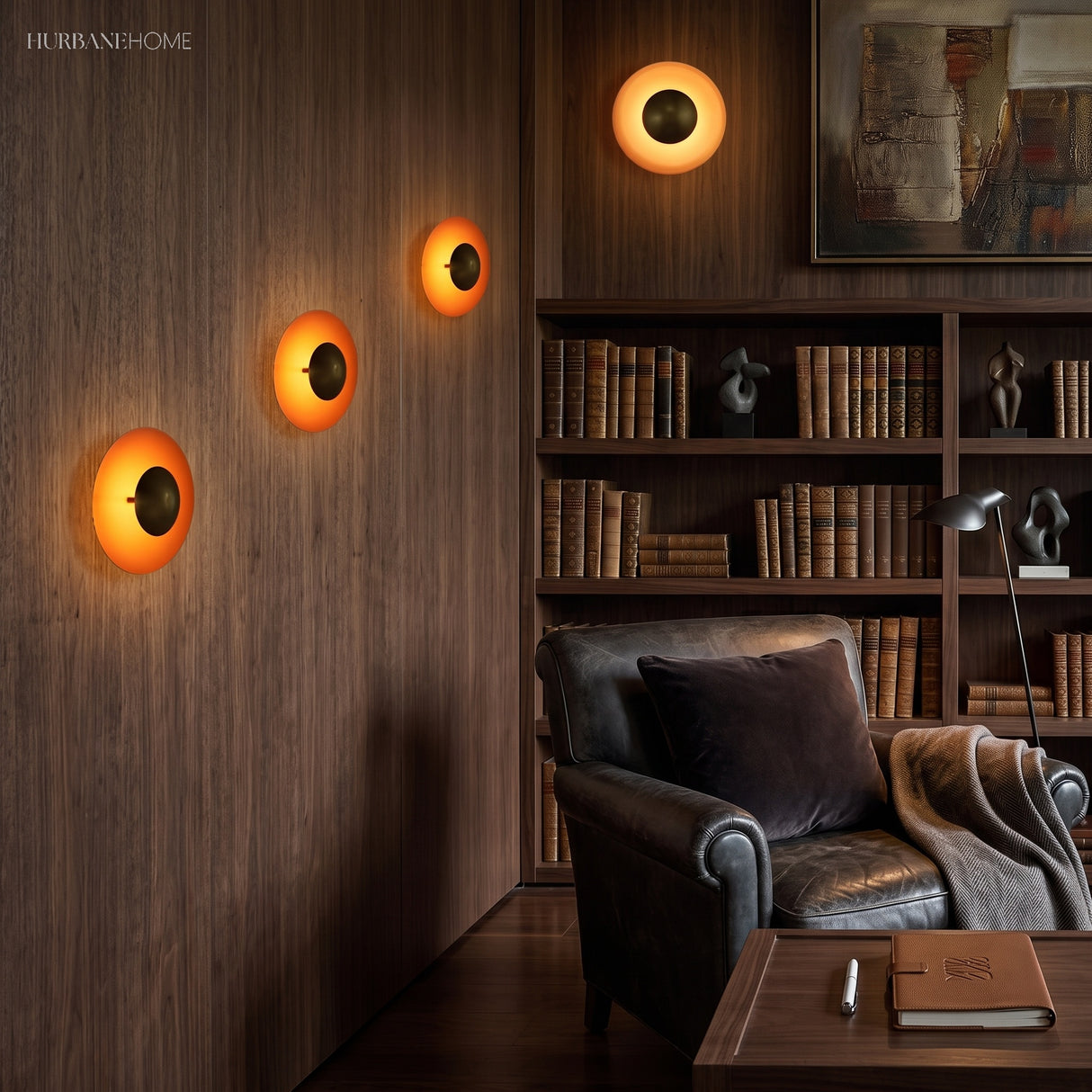 Four orange disc sconces lit in a row on a dark timber wall