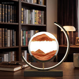 Red sand motion lamp lit on wooden desk before a bookshelf