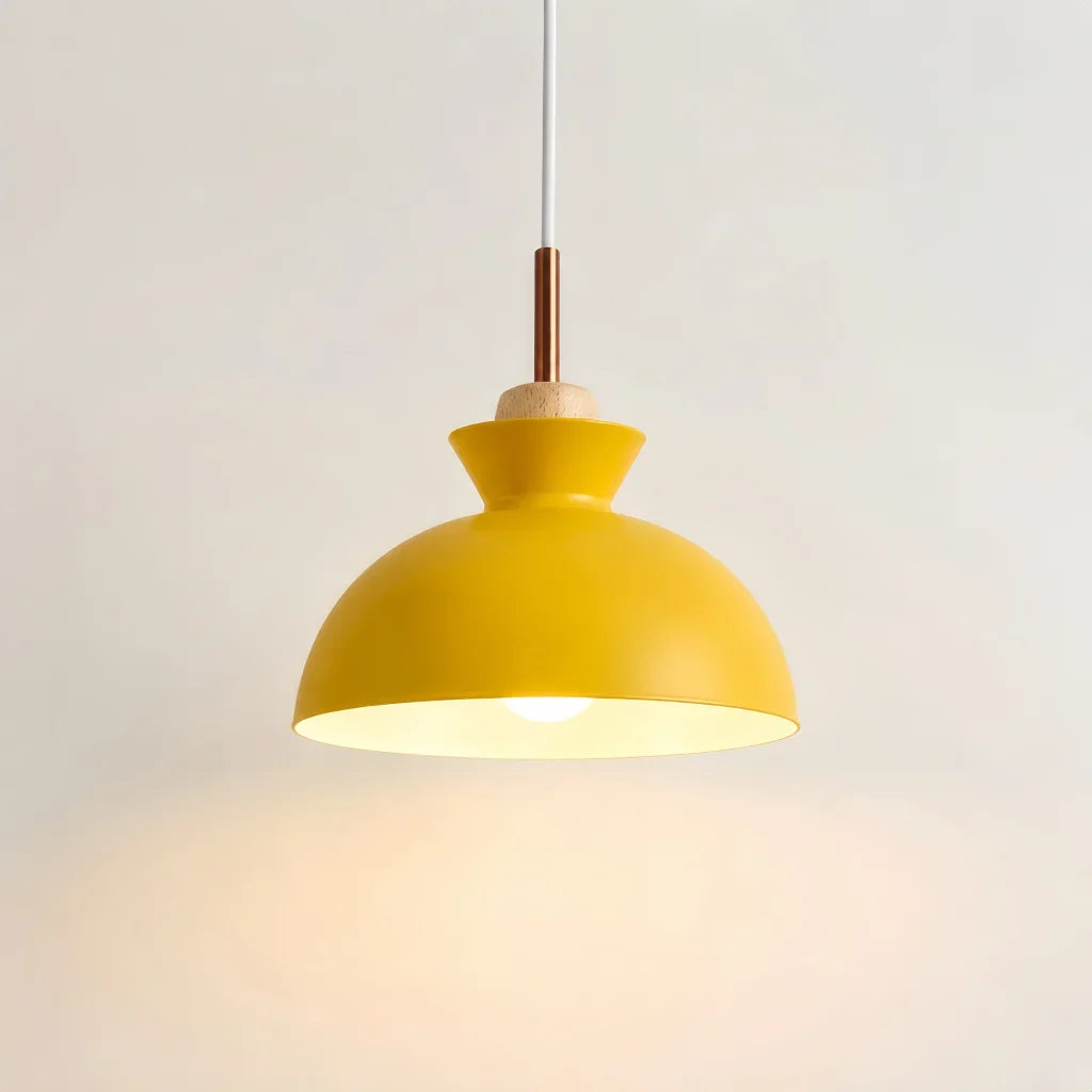 Scandinavian wood pendant light with metal dome shade shown on a plain background