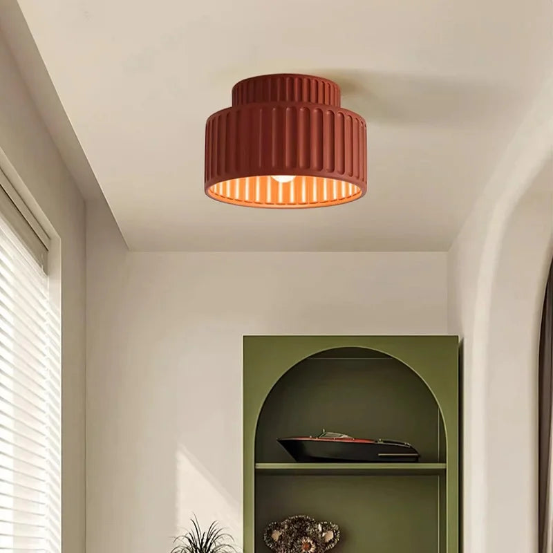 Semi flush mount ceiling light photographed from the front on a neutral background