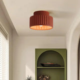 Semi flush mount ceiling light photographed from the front on a neutral background